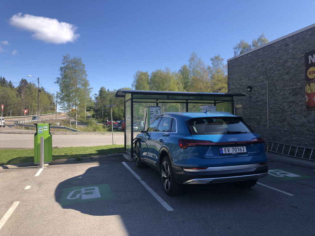 Electric car charging at a service station in Norway