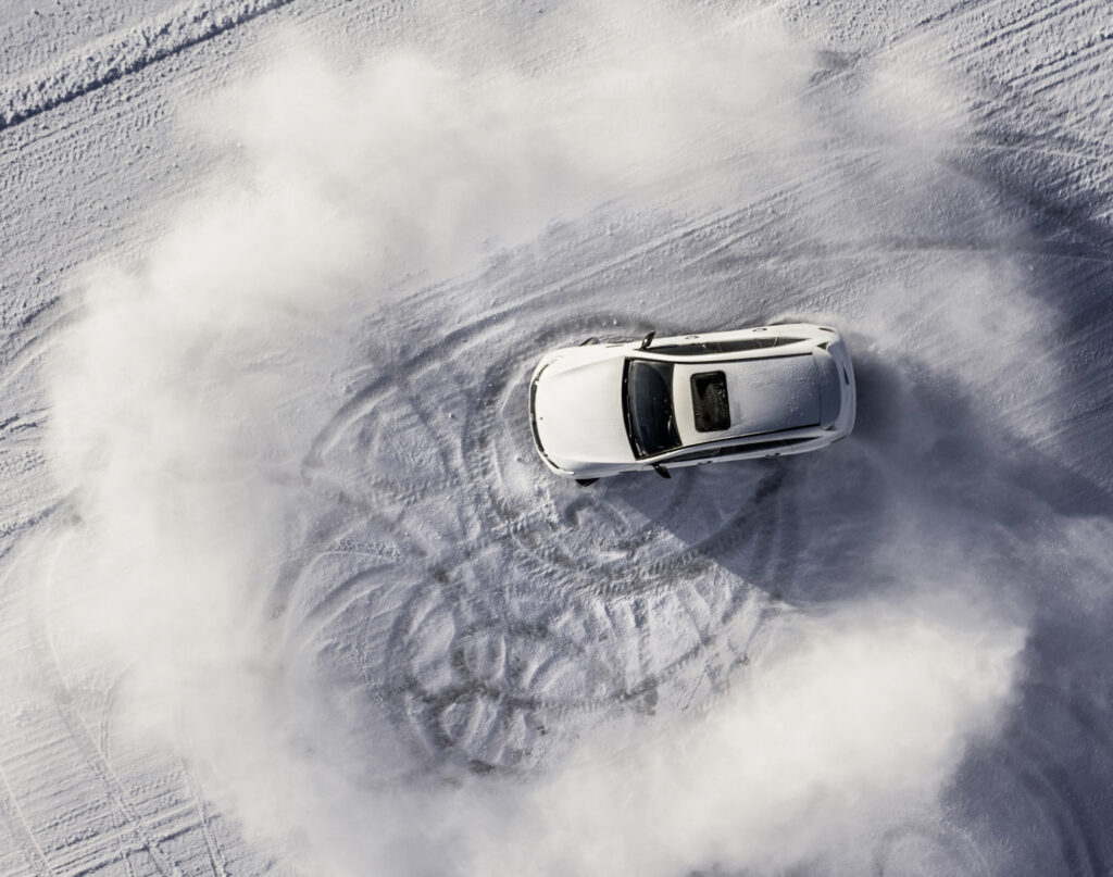 Mercedes-Benz EQC doings slides and donuts on ice