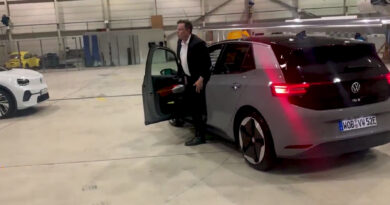 Tesla chief Elon Musk getting out of a Volkswagen ID.3