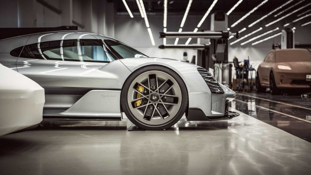 Porsche 919 Street concept with a clay model in the background believed to be the upcoming Porsche Macan electric vehicle