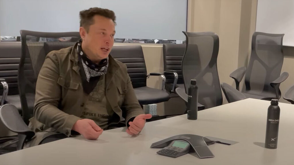 Tesla CEO Elon Musk being interviewed by automotive engineer Sandy Munro