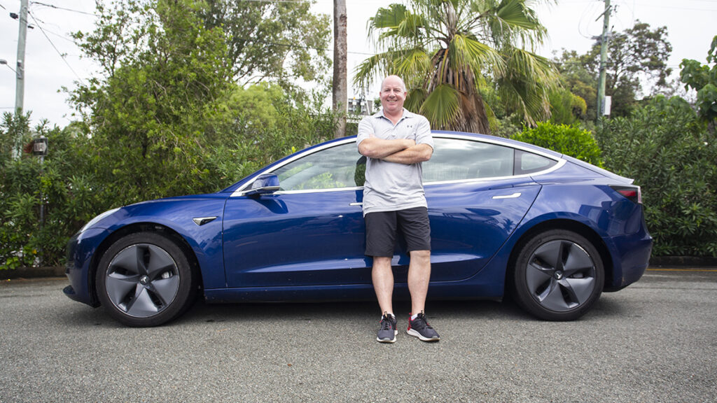 Ian Suter with his Tesla Model 3
