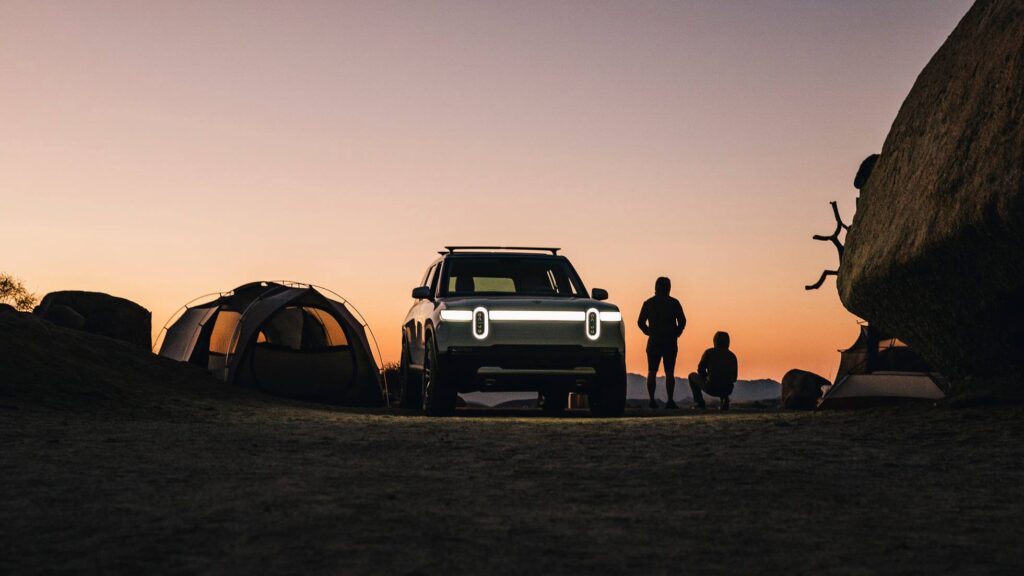 Rivian at a campsite