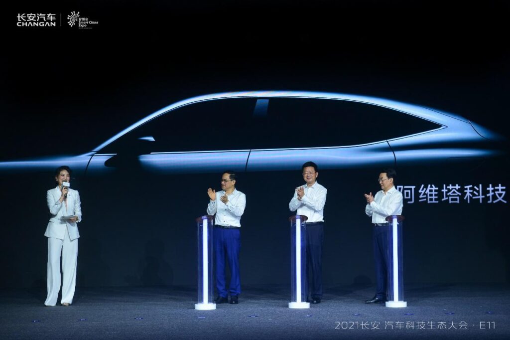 Changan Automobile executives standing in front of the silhouette of the new Avatar E11, which is due on sale by the end of 2021