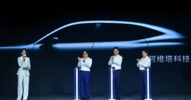 Changan Automobile executives standing in front of the silhouette of the new Avatar E11, which is due on sale by the end of 2021