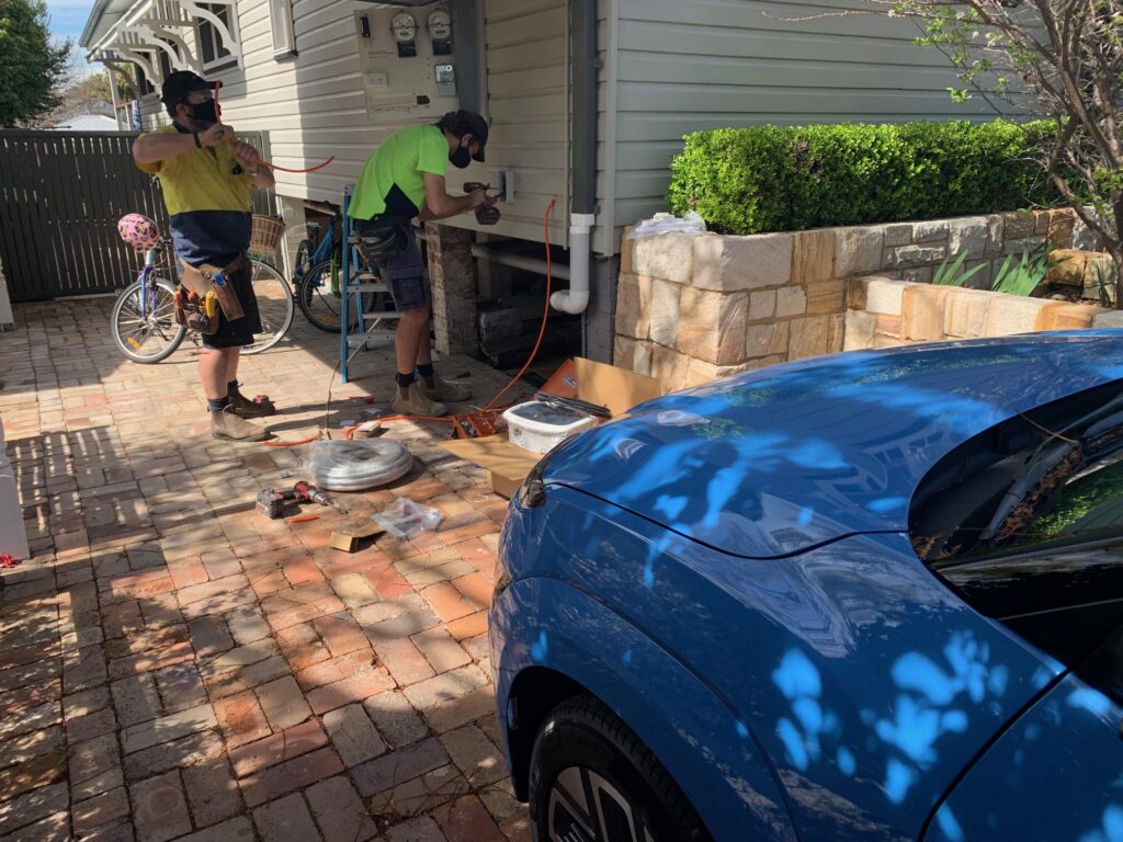 A wallbox charger being installed to power our Hyundai Kona Electric Extended Range
