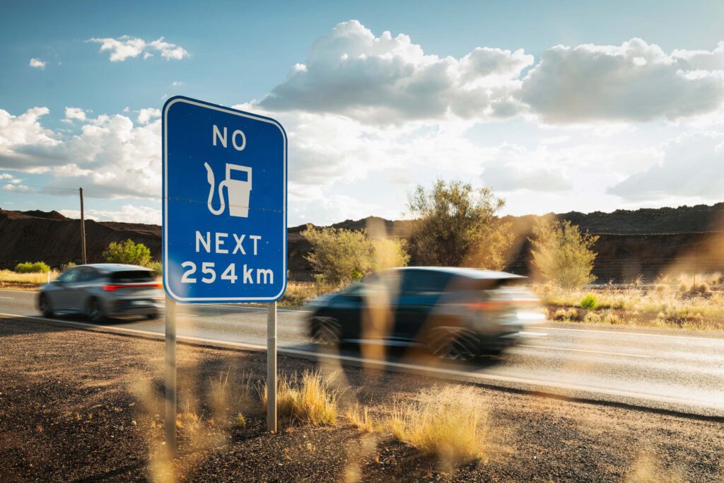 Cupra Born in the outback with a sign warning of no fuel for 254km
