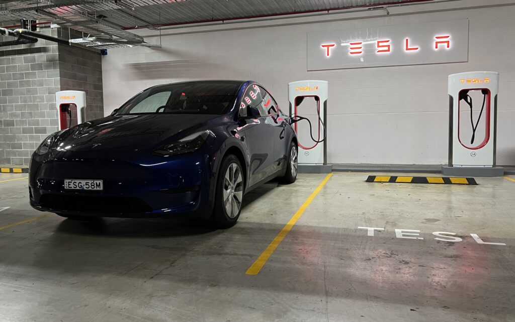 Tesla Model Y charging at a V3 Supercharger at Kirrawee in Sydney