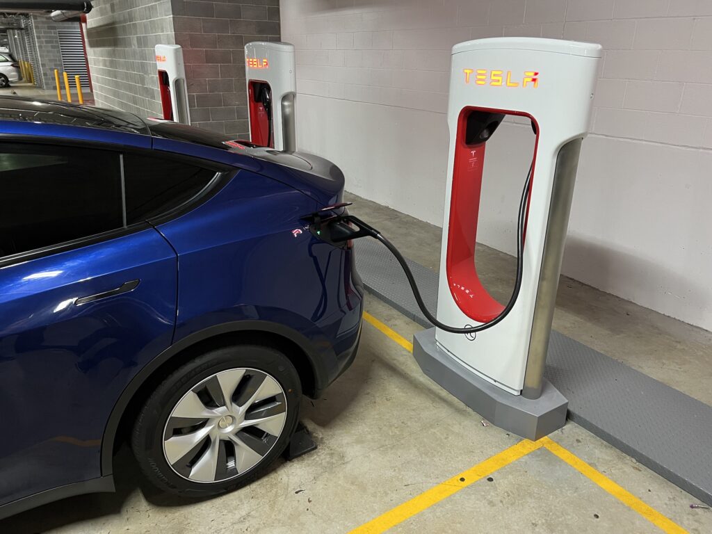 Charging a Tesla Model Y at a new V3 Supercharger EV Central