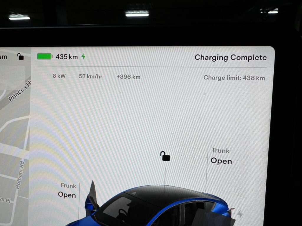 Tesla Model Y charging at a V3 Supercharger at Kirrawee in Sydney