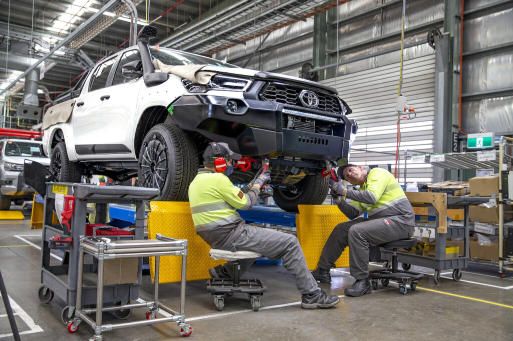 Workers build HiLux Rogue and HiLux Rugged X at the Toyota Conversions production line at the Toyota Centre of Excellence.