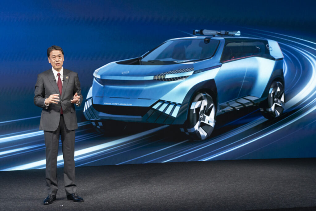Nissan chief Makoto Uchida with Hyper Adventure concept.