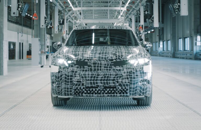 The upcoming BMW iX3 replacement in camouflage; the car is the first of the Neue Klasse EVs